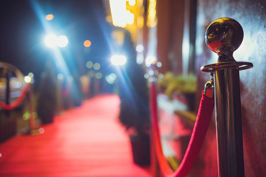 Red velvet ropes and poles at event